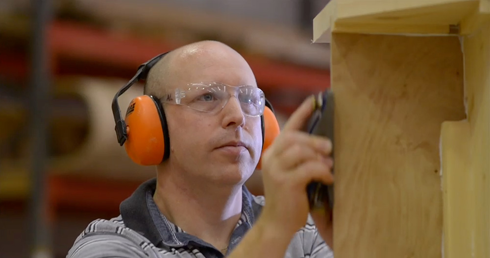 Attention to detail during staircase assembly using a hand plane in the Stairplan workshop